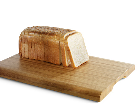 cut buckwheat bread on a cutting board in the kitchen