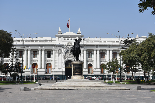 Lima, Peru - May 21, 2019: The Legislative Palace (seat of the Congress) and the statue of Simon Bolivar in Plaza Bolivar.
