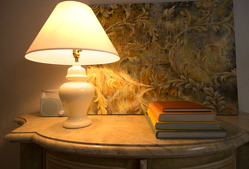 Nighttime Room with Illuminated Lamp, Stack Books, Painting