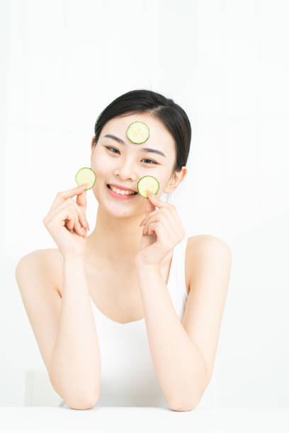 istock Korean beauty is making cucumber mask. 1306061558