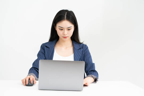 istock Young asian female white-collar workers are using laptops, studio shooting and white background 1306061567