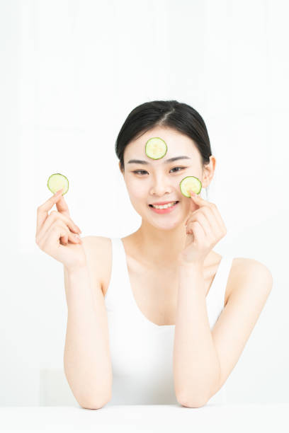 istock Korean beauty is making cucumber mask. 1306061793