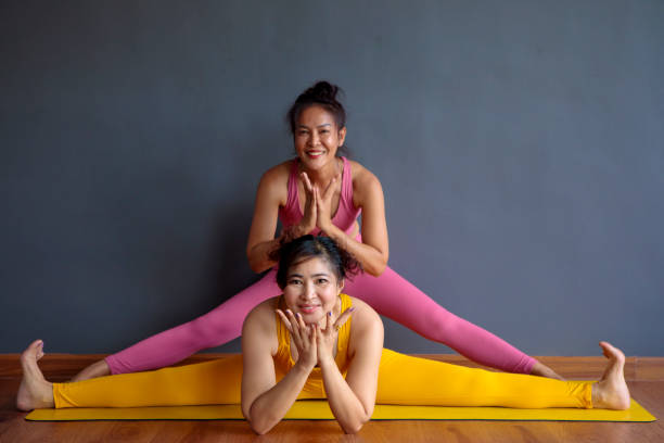 istock asian woman doing yoga pose 1306062292