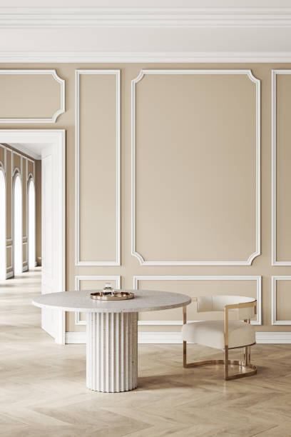 istock Beige classic interior with round table, chair, wall panel and moldings. 3d render illustration mockup 1306074856