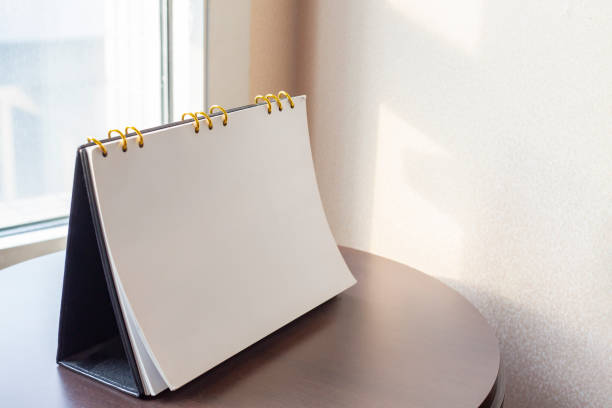 istock Desk calendar diary on hotel office table with year 2021 work place. Planning scheduling agenda, Event, organizer of plan 2020 to 2022. appointment, organization, management each date, month concept 1306075308