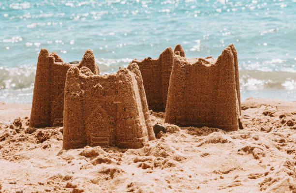 istock Sandcastles on the beach,vacation concept, toned 1306077546
