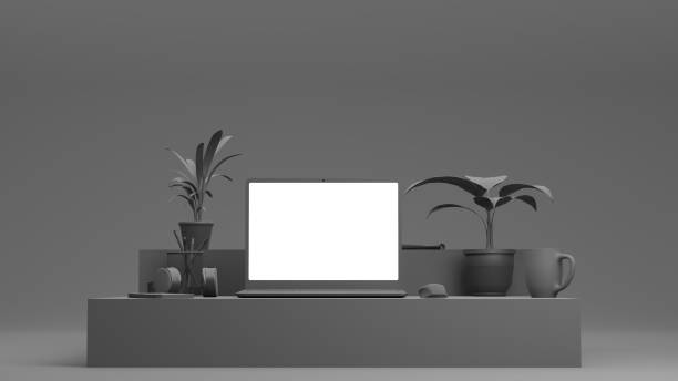 istock 3D render. Grey, monochromatic office table with laptop and phone. Mock-up. 1306079626