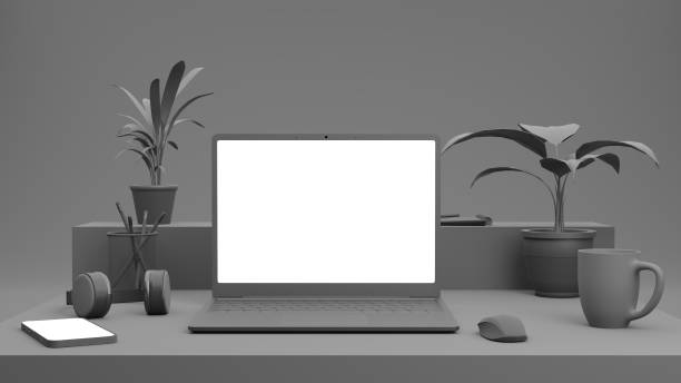 istock 3D render. Grey, monochromatic office table with laptop and phone. Mock-up. 1306079633