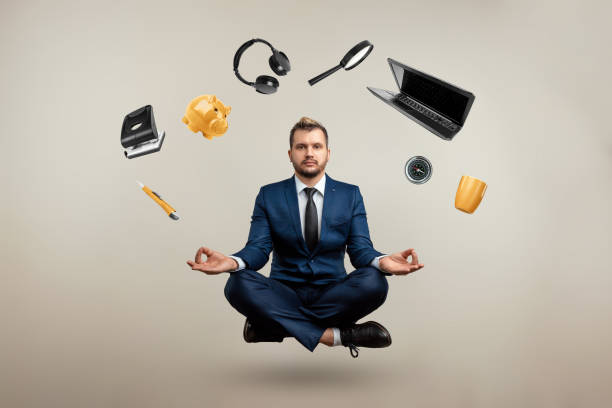 istock A professional businessman in a suit levitates with many objects. Works in different directions. Multitasking, efficient business worker concept. 1306079933
