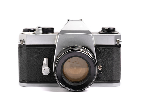 An old medium format camera with bellows lens from the 1940-50s flat lay.