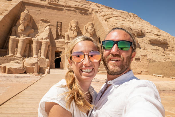 istock Couple travel in Egypt, take selfie with ancient temple 1306080702