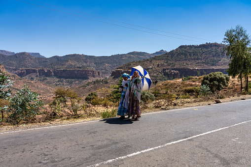 Axum, Ethiopia - Feb 10, 2020: Ethiopian people seen on the road from Axum to Gheralta, Tigray in Northern Ethiopia, Africa