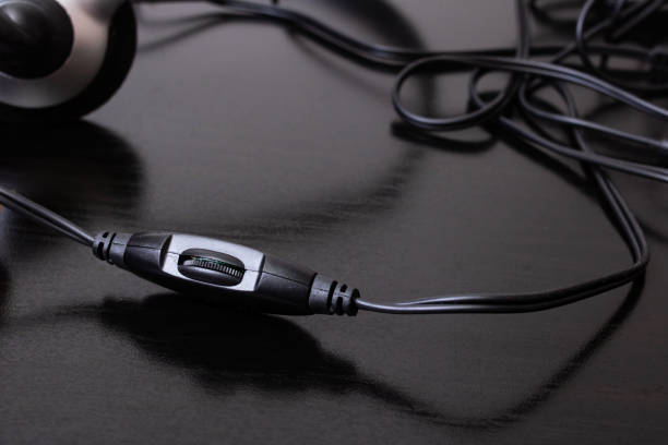 istock Volume control on the headphone wire closeup 1306081883