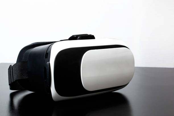 istock Black and white virtual glasses on a wooden table 1306081924