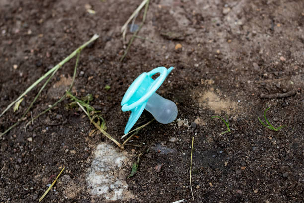 istock Lost blue baby nipple on the ground 1306082205