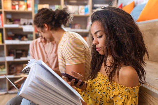 istock Portrait of young female student study in the library. 1306082276