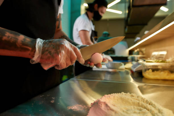 istock Man preparing food in the kitchen 1306083127