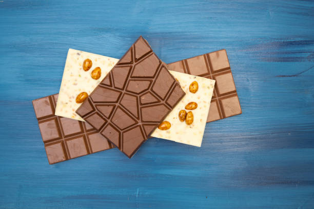 istock many different tasty chocolate bars on blue background 1306083989