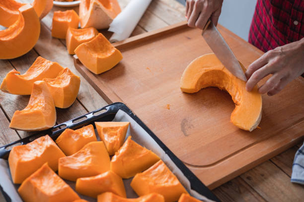istock Sweet pumpkin cut into pieces ready for roasting 1306083992