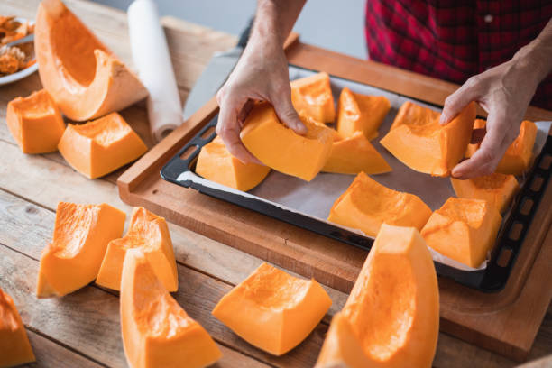 istock Sweet pumpkin cut into pieces ready for roasting 1306084016