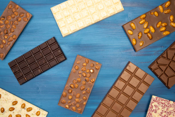istock many different tasty chocolate bars on blue background 1306084114