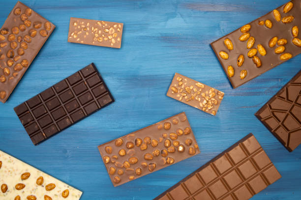 istock many different tasty chocolate bars on blue background 1306084189