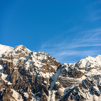 Snow capped mountain range of Monte Carega, also called the Small Dolomites (Piccole Dolomiti) from the Altopiano della Lessinia (Lessinia Plateau). Veneto and Trentino Alto Adige, Italy, Europe.