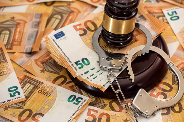 istock Handcuffs and euro banknotes 1306087620