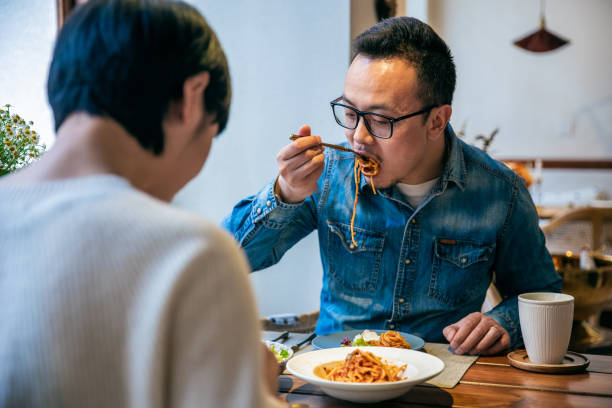 istock Young couple eating in the restaurant 1306088418