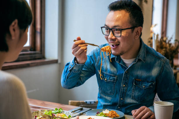 istock Young couple eating in the restaurant 1306088497