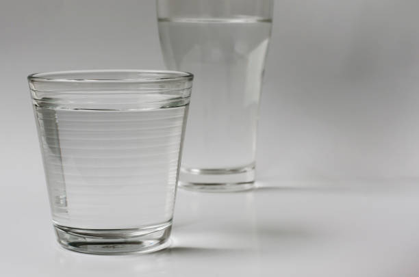 istock Glass of Drinking Water on Clear White Background. 1306089401