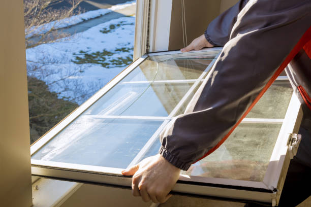 istock Worker the hands of the master repaired replaced the plastic window 1306089467