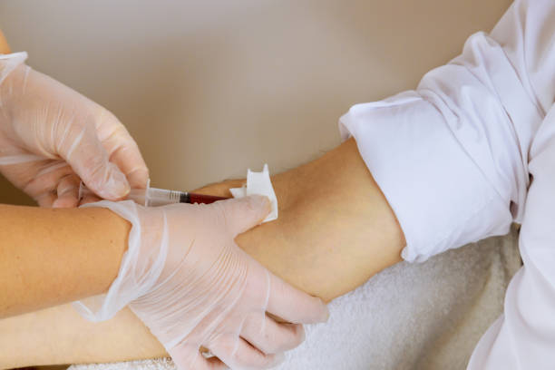istock Laboratory nurse takes blood sample from arm on the analysis 1306089472