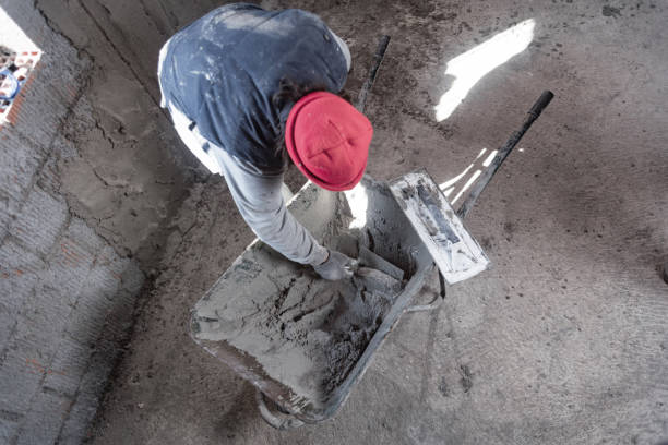 istock Real construction worker working on a wall inside the new house. 1306091129