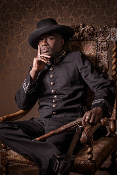 African traditionally dressed european man with a weapon
