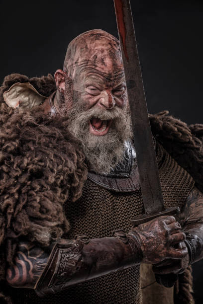 istock Weapon wielding senior viking warrior in studio shot 1306092706