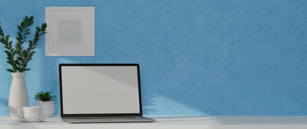 istock 3D rendering, home office desk with laptop, mock up frame, plant pots and copy space, clipping path 1306093703