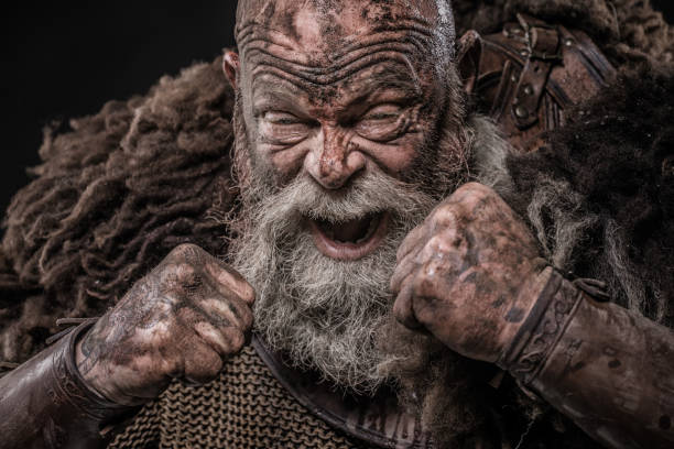 istock Weapon wielding senior viking warrior in studio shot 1306093928