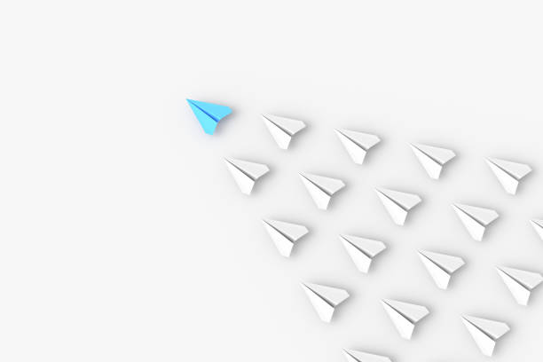 Leadership concept, blue leader plane leading white planes, on white background stock photo