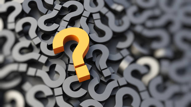 istock Yellow question mark on a background of black signs, FAQ Concept 1306095024