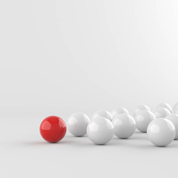 istock Leadership concept, red leader ball leading white balls, on white background with empty copy space 1306096809
