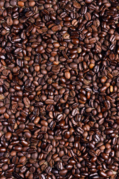 istock Roasted Ccoffee beans background. Arabic roasting coffee. Ingredient of hot beverage. 1306096887