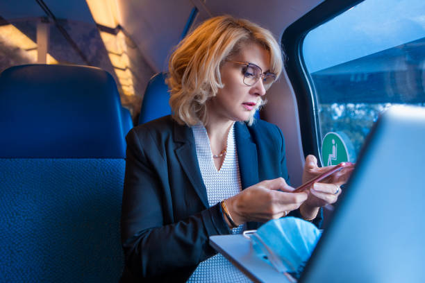 istock Corona practices for a commuter train traveller businesswoman 1306098021