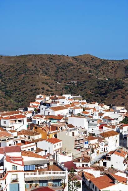 istock White village in mountains, Moclinejo, Spain. 1306098040