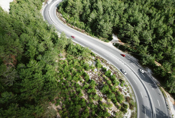 istock Red color challenge ,Vehicles going on mountain winding road roads 1306105993