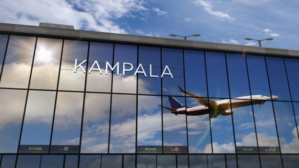 istock Airplane landing at Kampala Uganda airport mirrored in terminal 1306106152