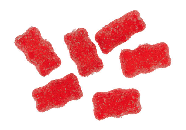 istock Red generic sugar coated gummy bears on a white background. 1306107128