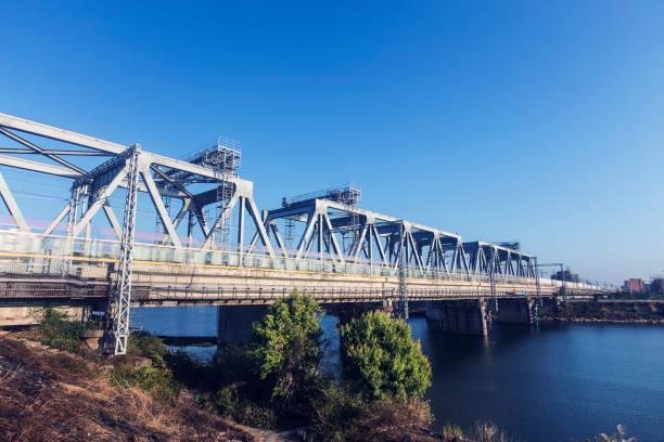 istock High-speed rail driving on the bridge 1306107134
