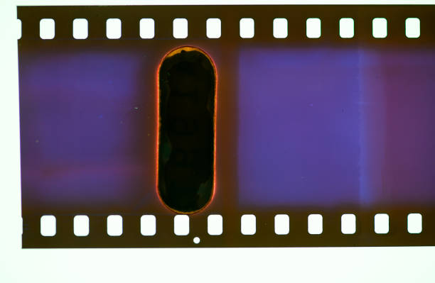 istock Dark Film Strip With Light Leak 1306107237