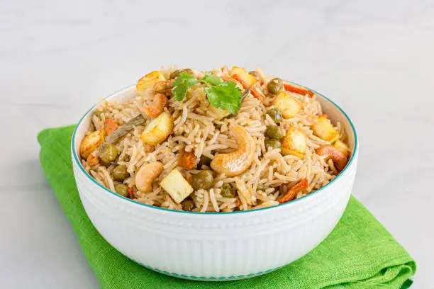 Indian Vegetarian Fried Rice with Paneer Garnished with Cilantro